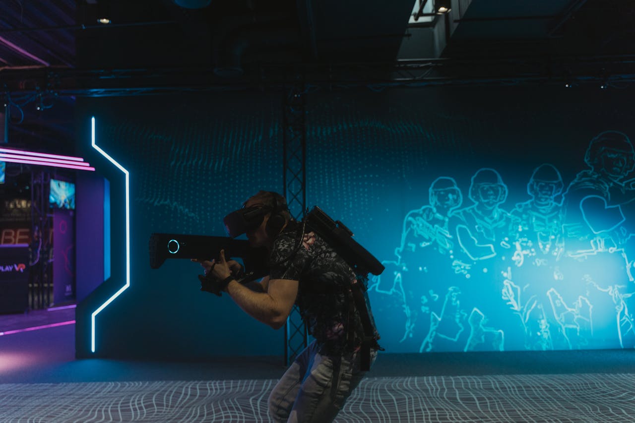 A man fully engaged in an immersive virtual reality gaming experience indoors.